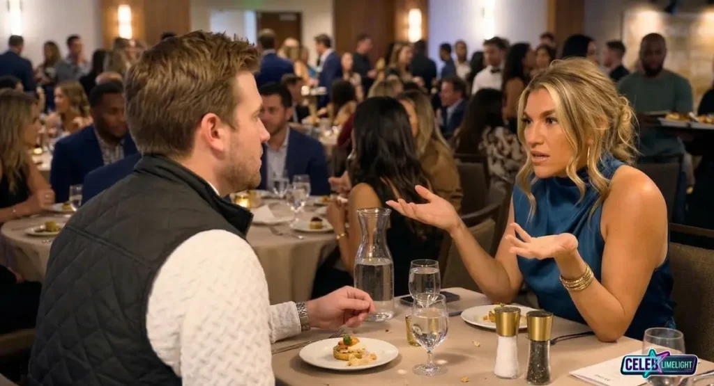 Wide shot of Love Is Blind Season 6 stars Amber Desiree (AD) and Matthew Duliba having a tense conversation at a crowded cast dinner party.